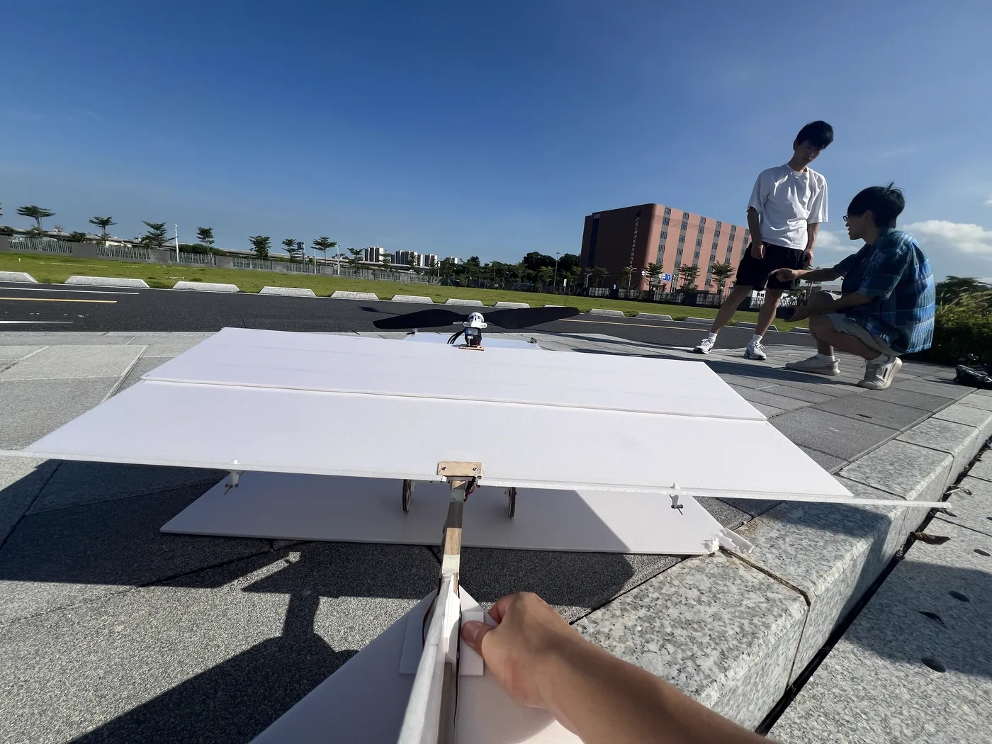 Foam-board wing validation aircraft prepared outdoors for a rapid flight test